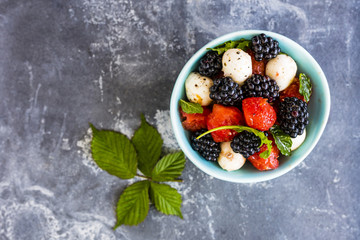 Delicious summer salad with watermelon and blackberry with mozzarella cheese.