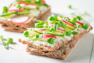 Closeup of sandwich with avocado and fromage cheese