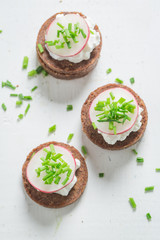 Sandwich with pumpernickel bread, cottage cheese and chive