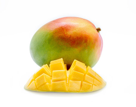 Mango fruit and mango cubes isolated on white background.