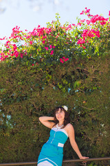 Outdoor fashion portrait summer style of young beautiful woman fresh face smiling on tropic island having fun on vacation in blue dress