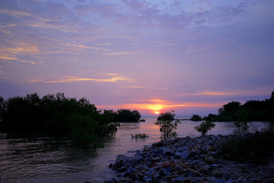 Colorful sunset over ocean on Pantai Jeram, Kuala Selangor, Selangor, Malaysia