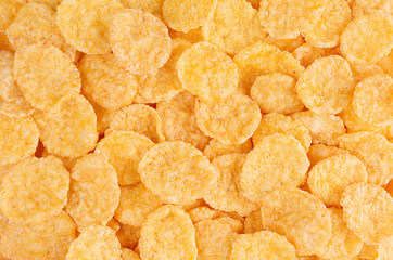 Golden corn flakes closeup. Cereals texture.