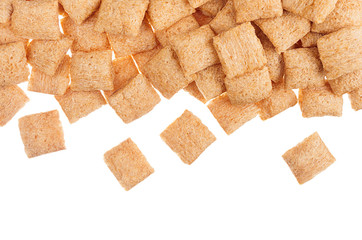 Decorative border of golden pads corn flakes isolated with copy space background.