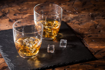 Whiskey with ice in glasses
