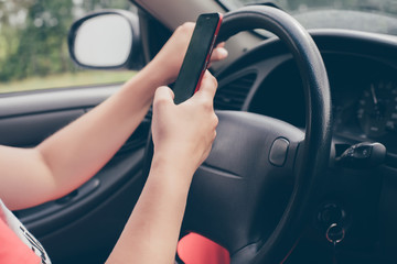 Naklejka premium Woman is driving a car and wants to call.Dangerous situation on the road