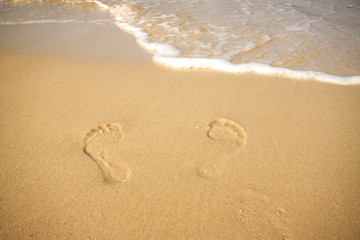 Footprints on the beach./Footprints on the beach.