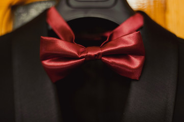 Men's accessories, bow tie top view, flat lay on wooden board background