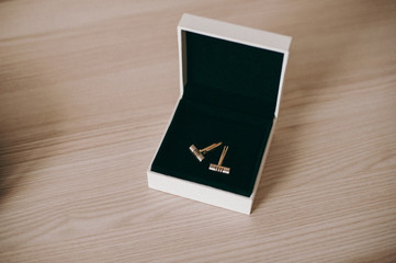 groom's cufflinks in a box