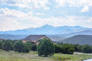 Snowy day in Ruidoso mountains. View to forest, house and mountains. New Mexico, United states of America