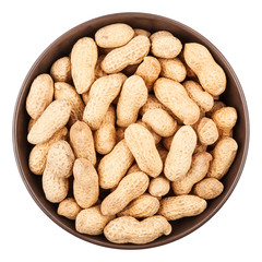 Unpeeled peanuts in ceramic bowl closeup, top view