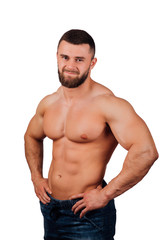 Portrait of a strong bearded male fitness model, torso. White background, isolate. hands on his...