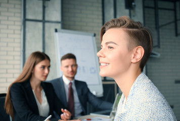 business woman with her staff, people group in background at modern bright office indoors.