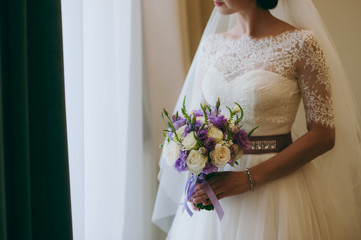 Bride holding big wedding bouquet on wedding ceremony