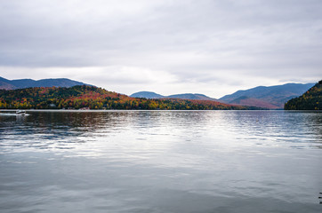 Mountain Lake in Autumn and Cloudy Sky.