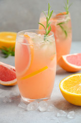 Refreshing citrus cocktail with grapefruit, orange and rosemary