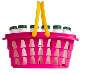 Shopping basket with white plastic bottles isolated on white.