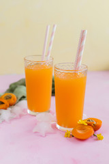 Apricot juice ice on yellow background