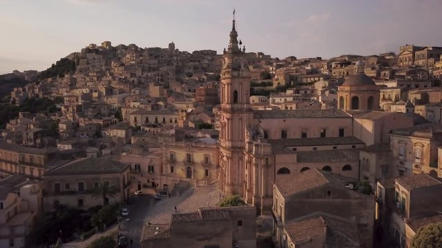 sunset flying clockwise around San Giorgio cathedral in Modica