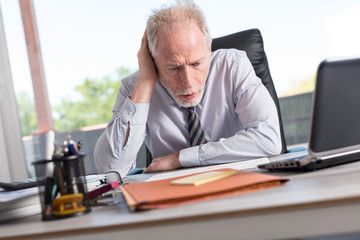 Portrait of concerned businessman