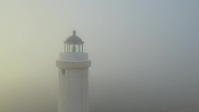 Lighthouse at dawn - aerial view 4k