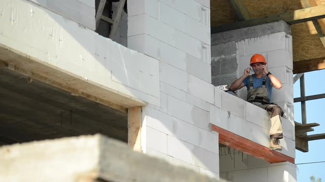 Construction Worker on the Residential Construction Site