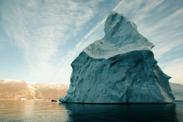 Obraz na płótnie Canvas Giant Iceberg with Inflatable Boat Scale - Greenland