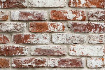 Red brick wall with white paint. texture, background, design.
