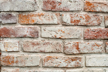 Red brick wall with white paint. texture, background, design.