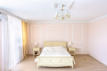 White apartment interior design bedroom with classic furniture, curtains, modern style in chisinau, cenral district, moldova