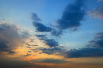 Clouds with light rain, the sun is about to fall evening.