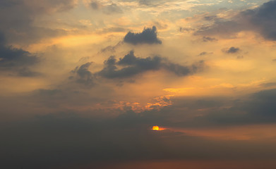 Clouds with light rain, the sun is about to fall evening.