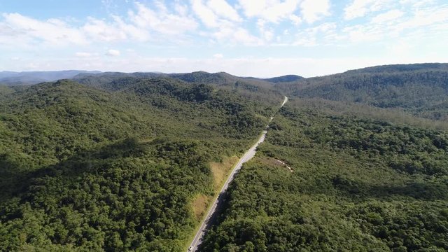 Aerial shot of a road and forest