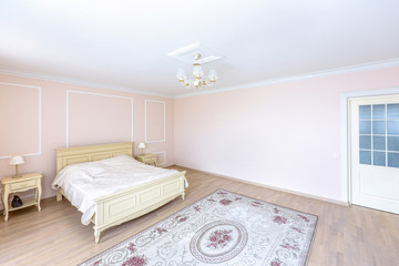 Fototapeta na wymiar White apartment interior design bedroom with classic furniture, curtains, modern style in chisinau, cenral district, moldova