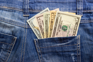 American dollar bills in jeans pocket background