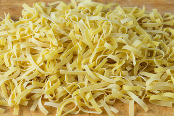 Healthy pasta on a rustic wooden table, homemade egg noodles