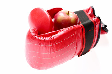 Boxing gloves in red color. Knock out and healthy nutrition