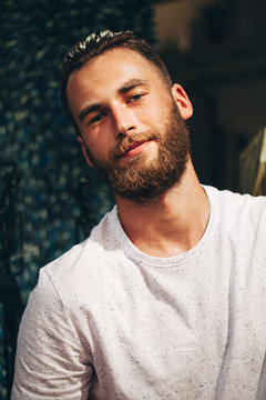 Portrait of a Hipster man with the beard close up