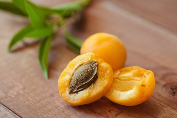 Ripe fruits of apricots on a wooden table