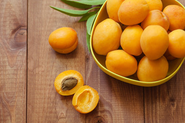 Apricot fruit. Fresh organic apricots on a white wooden background. Vega food.