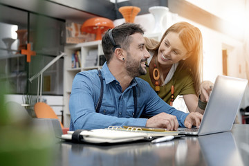 Start-up people working on laptop in office