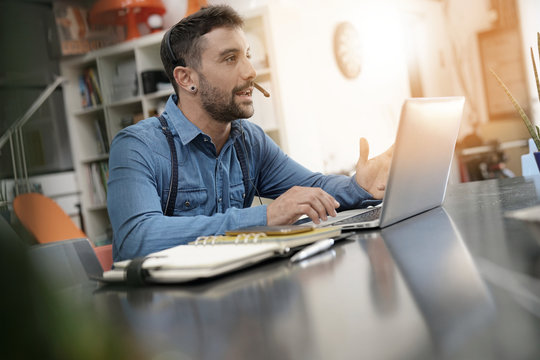 Startup entrepreneur making video conference call