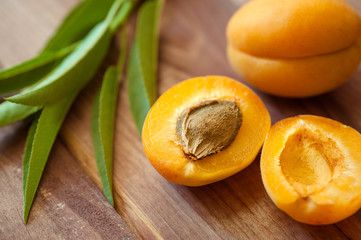Ripe apricots on wooden background