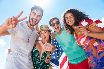Happy youthful friends relaxing outdoor together