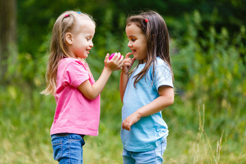 Fototapeta premium Two Little Girls Having Fun in the Park