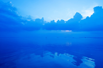 Blue sky hour after sunset. Dusk sea and clouds scape.