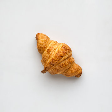 french croissants on a light background top view