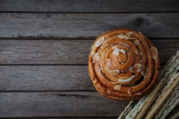 fresh bread and baked goods on wooden chopping board, rustic style