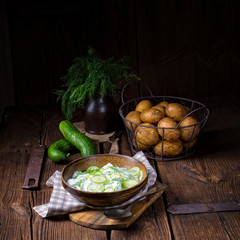 fresh cucumber salad with yogurt and young potatoes