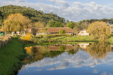Fototapeta na wymiar Lake and farm house in winter, Vale dos Vinhedos valley